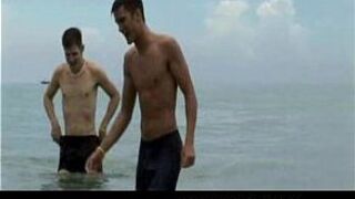 Two hunks play on the beach before jerking off - porn video